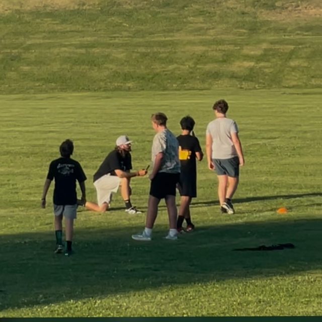 Kellz Camp reel — Coach Keller running a training session on the field