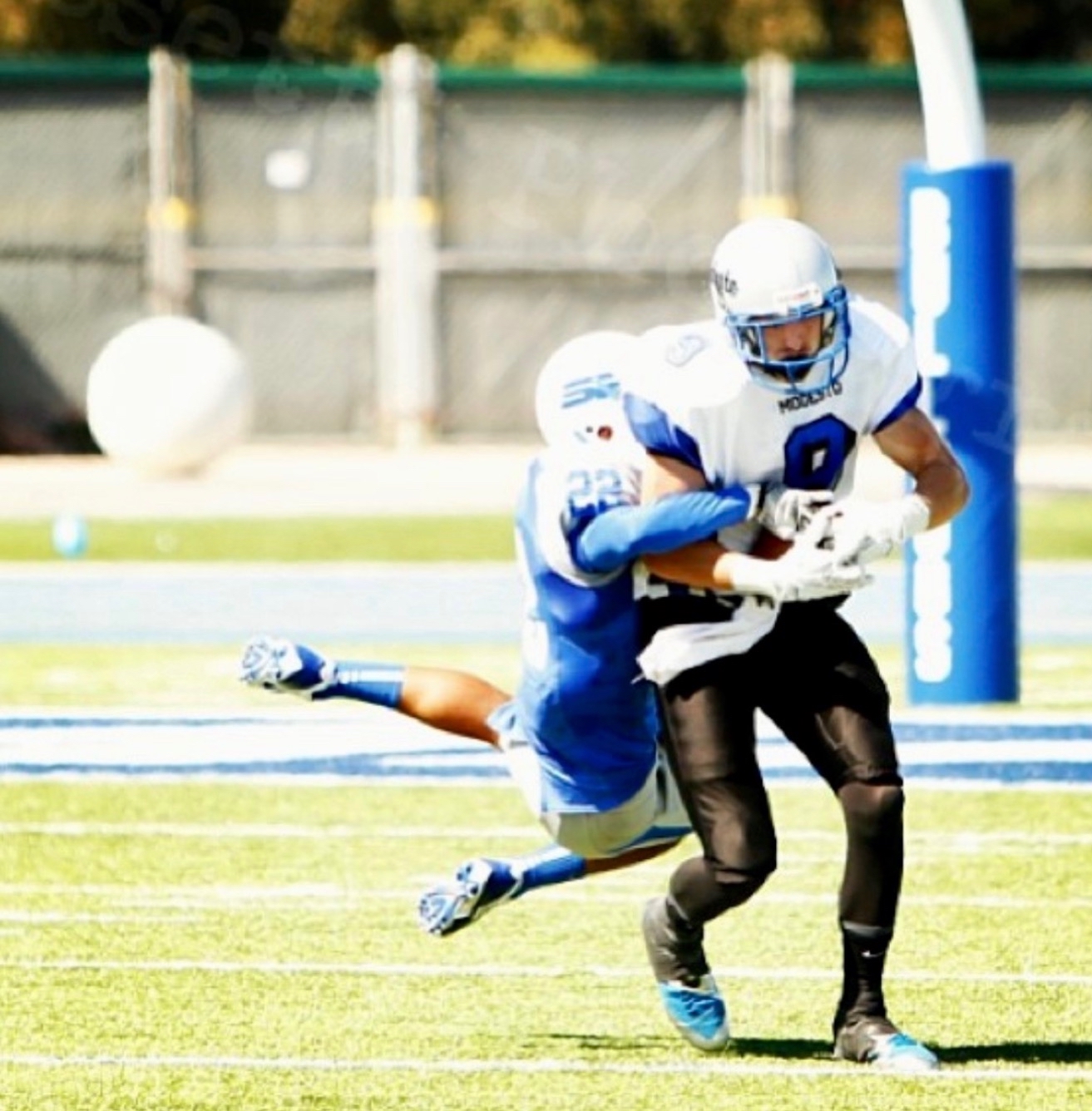 Corey Keller making a catch in a football game for Modesto