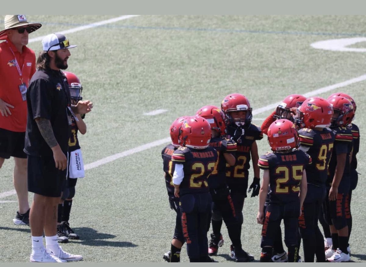 Coach Keller coaching youth football